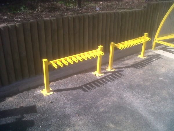 Freestanding 10 space scooter racks in yellow finish